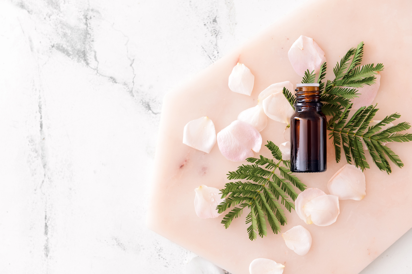 Bottle of Essential Oil on White Background